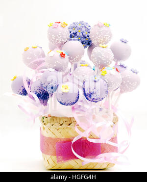 Cake pop bucket, a bunch of cake pops  decorate with webbing from bambo, with a ribbon Stock Photo
