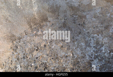 Close up of ice crystals with pebbled or cobblestone texture on window pane. Frost is white, clear, gray and brown and is opaque Stock Photo
