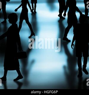 Editable vector silhouettes of people walking in a crowded hall with shadows made using a gradient mesh Stock Vector