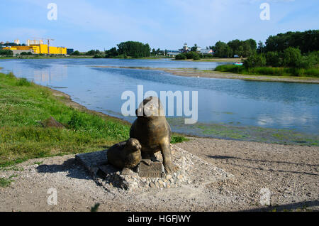 The statue of Nerpa, the Baikal Seal, on the Angara riverbank. Stock Photo