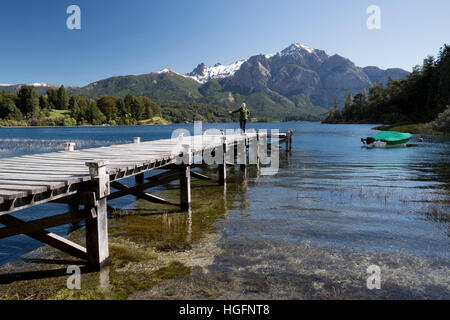 Wooden pier and snow-capped mountains on Lago Perito Moreno, Llao Llao, near Bariloche, Nahuel Huapi National Park, The Lake District, Argentina, Sout Stock Photo