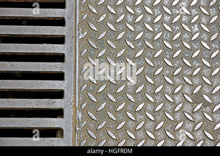 Steel plate slip old metal floor sheet,rusty   texture, metallic ,  industry background, aluminum surfaces , industrial shiny  silver with rhombus shapes. Stock Photo