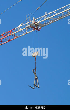 Crane boom in operation.  of mobile  with blue sky background. Stock Photo