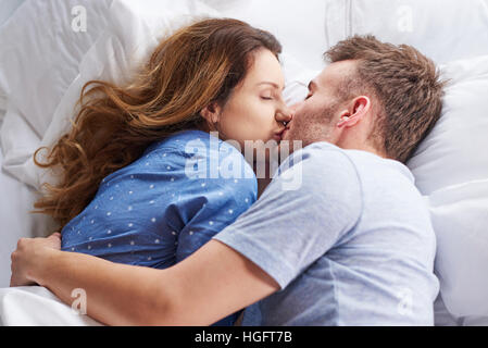Top view of kissing couple Stock Photo