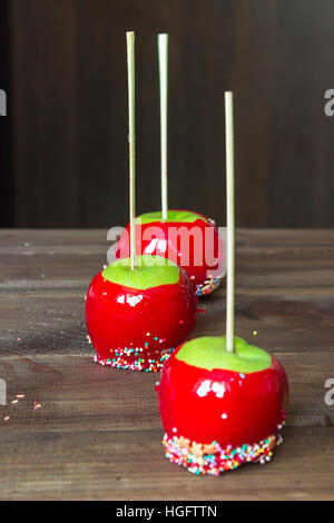 candy apples on wooden table Stock Photo