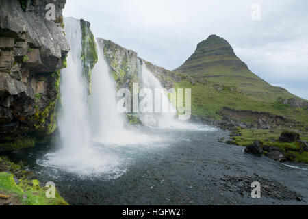 View of the Kirkjufell mountain (Church mountain), and the Kirkjufellsfoss waterfalls, in the Snaefellsnes peninsula, west Iceland Stock Photo