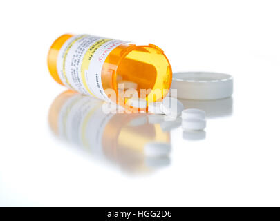 Non-Proprietary Medicine Prescription Bottle and Spilled Pills Isolated on a White Background. Stock Photo