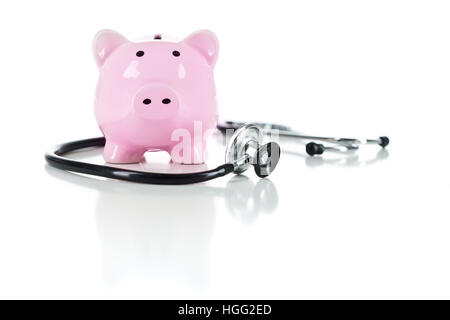 Piggy Bank and Stethoscope Isolated on a White Background. Stock Photo