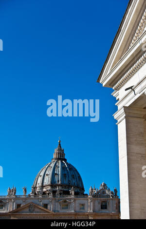 Saint Peter's Basilica (facade detail) and dome, seen from the beginning of the colonnade. Vatican City, Rome, Italy, Europe. UNESCO world heritage Stock Photo