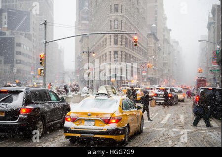 NEW YORK CITY - JANUARY 7, 2017: Traffic clogs Fifth Avenue as a blizzard hits Manhattan. Stock Photo