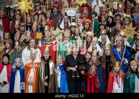 Berlin, Germany. 9th Jan, 2017. German Federal Chancellor Angela Merkel stands during the reception of carol singers from all over Germany in Berlin, Germany, 9 January 2017. Carol singers from all 27 dioceses in the country visit the chancellery for epiphany, as custom determines. Photo: Michael Kappeler/dpa/Alamy Live News Stock Photo