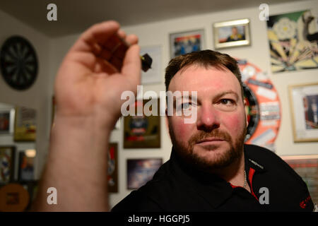 Darts player Brian 'Doggy' Dawson at his home in Thurnscoe near Barnsley, South Yorkshire, UK. Stock Photo