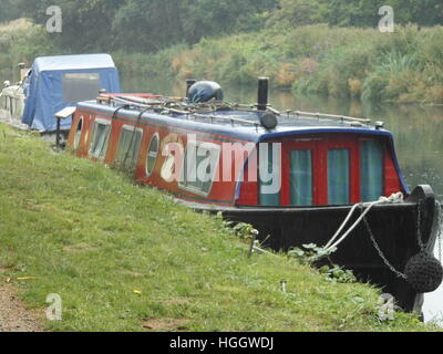 Red narrowboat moored on the Regents canal London Stock Photo