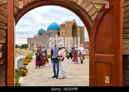 Kazakh people visiting the Khoja Ahmed Yasawi Mausoleum in Turkestan, Kazakhstan Stock Photo