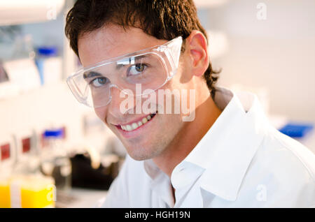 Portrait of a smiling young researcher inside his laboratory Stock Photo