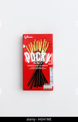 Close up of Pocky Chocolate flavour covered biscuit isolated against white background Stock Photo