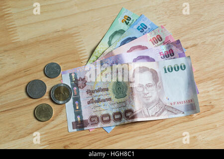 Thai banknotes and coins Stock Photo