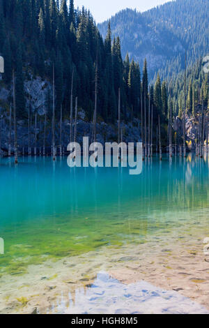 Kaindy Lake in Kazakhstan known also as Birch Tree Lake or Underwater forest. Stock Photo