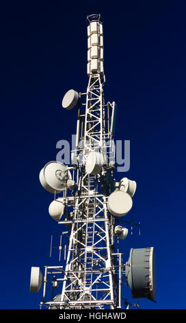 Communication antenna tower on blue sky Stock Photo