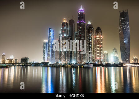 Night view of Dubai Marina with reflections in the harbour Stock Photo