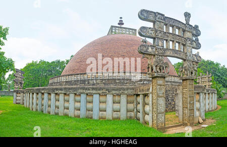 The Torana Gates, decorated with reliefs and fine patterns surround replica of Great Indian Sanchi Stupa, located in Mihintale, Sri Lanka. Stock Photo