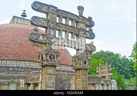 The Torana Gate of Stupa in Mihintale  (replica of Great Sanchi Stupa in India) decorated with figures of elephants, holding the vertical beams, Sri L Stock Photo