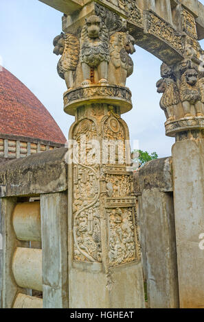 Detail of Torana Gate of Great Sanchi Stupa's replica in Mihintale with figures of lions and complex reliefs on the vertical beam, Sri Lanka. Stock Photo