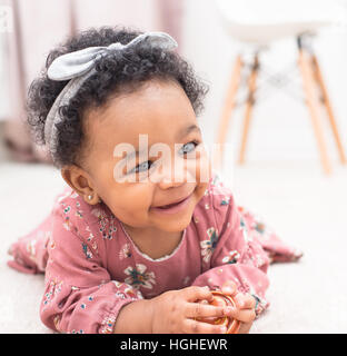 Baby Smiling in her Nursery Stock Photo