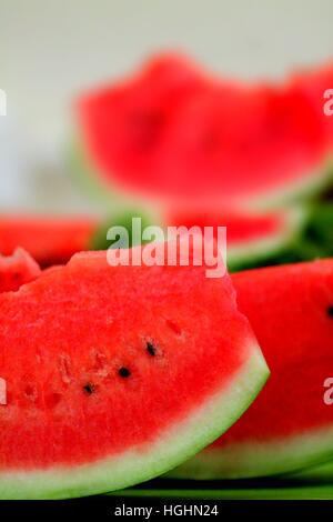 Fresh ripe watermelon slices with black seeds close up. Stock Photo