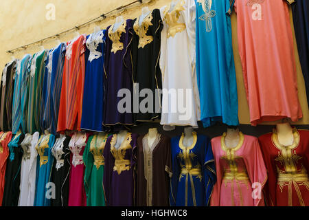 Multicolored clothes on a souk in Fez, Morocco Stock Photo
