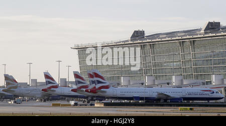 British Airways aircraft on the tarmac at Terminal 5 at London's Heathrow Airport as members of the airline's cabin crew hold a 48 hour strike in a row over pay. Stock Photo