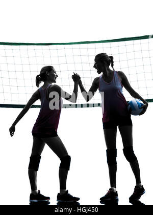 two caucasian women volleyball in studio silhouette isolated on white background Stock Photo