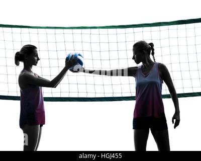 two caucasian women volleyball in studio silhouette isolated on white background Stock Photo