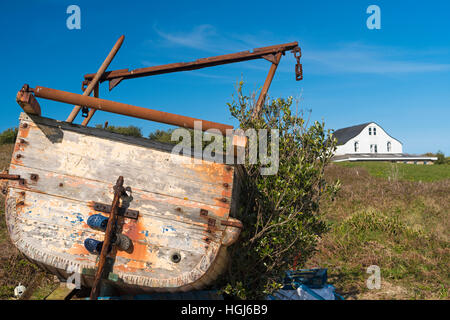 old fishing boat and house with curved roof to deflect the wind on Gugh, Isles of Scilly, Scillies, Cornwall in April Stock Photo