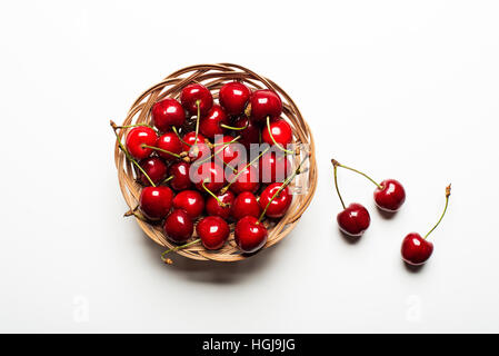 Fresh Cherry basket on white background close up Stock Photo