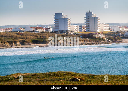 surfers make the best of the waves and sun in Peniche, Portugal Stock Photo