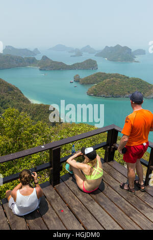 Sweaty tourists on top of the hill on the Koh Wua Talab Island at the Ang Thong (Angthong) National Marine Park in Thailand.