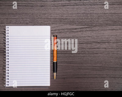 Wood Desktop, Spiral Notebook, Pen on Desk Stock Photo