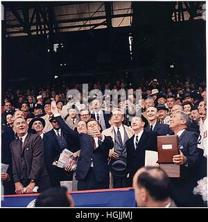 United States President John F. Kennedy throws out first ball at Griffith Stadium in Washington, DC on April 10,1961. (first row) Vice President Lyndon B. Johnson, President Kennedy, Dave Powers, Elwood Quesada. (second row) Secretary of Health, Education, and Welfare (HEW) Abraham Ribicoff, Assistant Press Secretary Andrew Hatcher, U.S. Senator Hubert Humphrey (Democrat of Minnesota), U.S. Senator Everett Dirksen (Republican of Illinois), U.S. Senator Mike Mansfield (Democrat of Montana). (third row) Lawrence O'Brien, spectators. The Senators lost the game to the Chicago White Sox 4 - 3.Cr Stock Photo