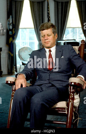 Washington, Us. 17th July, 2006. Washington, DC - Undated File Photo c. 1963 -- United States President John F. Kennedy sits in his rocking chair in the Oval Office of the White House in Washington, DC Credit: Arnie Sachs - CNP - NO WIRE SERVICE - Photo: Arnie Sachs/Consolidated News Photos/Arnie Sachs - CNP/dpa/Alamy Live News Stock Photo