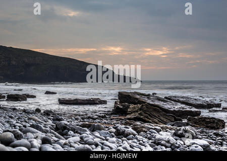 Ogmore By Sea, Wales, UK. 22nd January, 2017. Low cloud meant a grey day as the sun struggled to pierce the cloud at Ogmore By Sea, South Wales, today 22nd January 2017. Temperatures hovered around 6 degrees Centigrade as dog walkers and fishermen enjoyed the coast in the afternoon. Credit: Chris Stevenson/Alamy Live News Stock Photo
