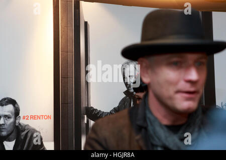 Edinburgh, UK. 22nd January, 2017. T2 Trainspotting premiere at Edinburgh Cineworld. Artist picture where the background is formed for two member of the T2 Transpotting (Ewan McGregor and Robert Carlyle) looking to Ewan McGregor who is walking. Stock Photo