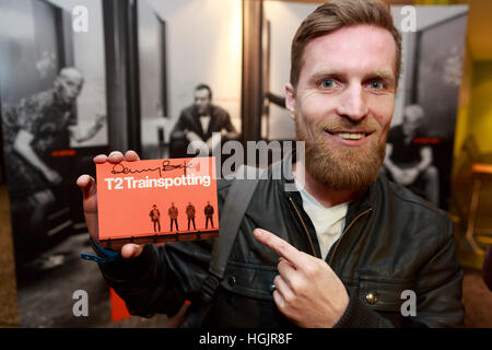 Edinburgh, UK. 22nd January, 2017. T2 Trainspotting premiere at Edinburgh Cineworld. Scotland. Pictured Kenny MacGregor member of the audience showing the T2 ticket signed by Danny Boyle.  Pako Mera/Alamy live News Stock Photo