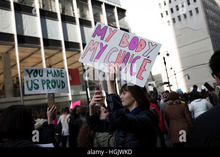 Protesters attend the 2017 NYC Women's March held on January 21, 2017 in in New York City, New York. Stock Photo