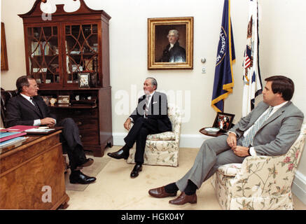 United States Vice President George H.W. Bush, left, discusses US President Ronald Reagan's schedule with Donald Regan, Chief of Staff to the President, center, and Craig Fuller, Chief of Staff to the Vice President. The three men met shortly before noon on July 15, 1985 in the Vice President's West Wing office. Vice President Bush cancelled a trip to Missouri and Ohio in order to be in Washington this week for the conduct of official business. Mandatory Credit: David Valdez / White House via CNP     - NO WIRE SERVICE - Photo: David Valdez/White House Pool/Consolidated/dpa Stock Photo