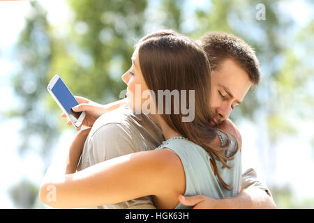 Cheating Girlfriend Chatting On Phone While Boyfriend Sleeping In Bedroom Stock Photo - Alamy