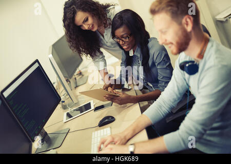 Programmer working in a software developing company office Stock Photo