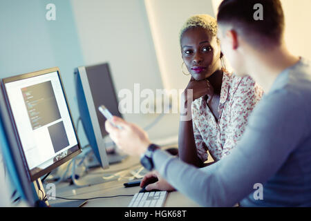 Programmer working in a software developing company office Stock Photo