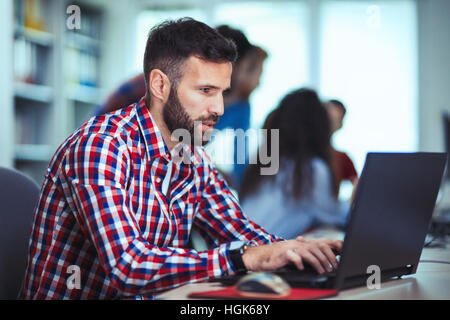 Programmer working in a software developing company office Stock Photo