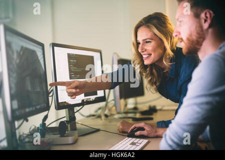 Programmer working in a software developing company office Stock Photo